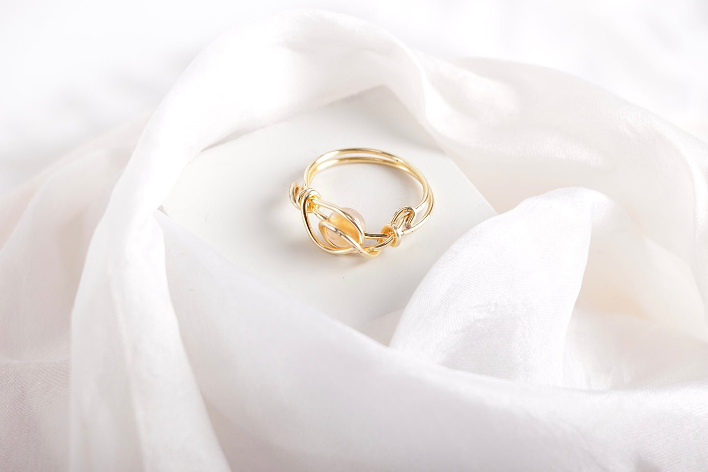 Love's Embrace ring in orange hues